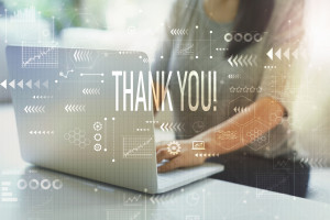Thank you with woman using laptop